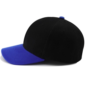Detail view of two-tone baseball cap featuring black crown and royal blue brim texture