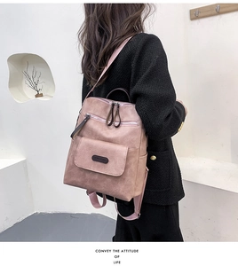Side view of soft pink PU leather backpack with荔枝纹 texture and side pocket details