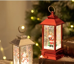 Close-up of Santa Claus and Snowman water lanterns with festive metal finish