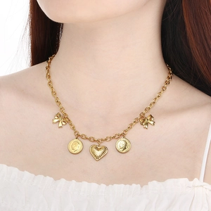 British style gold layered necklace with Elizabeth coin, heart, and bow pendants for women