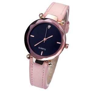 Detail of pink frosted strap and rose gold quartz watch with a minimalist diamond dial