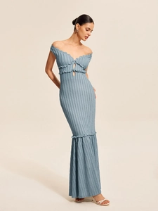 Detail of blue knitted fishtail dress featuring wavy texture and elegant backless cut