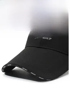 Close-up of black baseball cap featuring SPORT printed brim and white letter embroidery