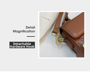 Detail view of the deep brown leather bag with a detachable gold metal hook and strap
