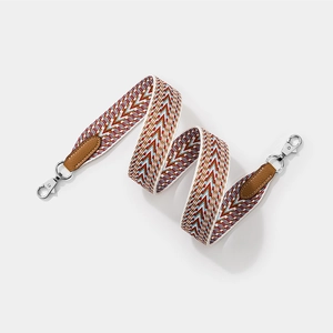 Bohemian woven wide shoulder strap with red and blue zigzag pattern and leather ends