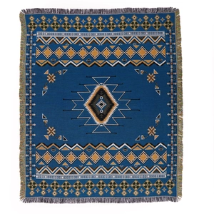 Bohemian style knit picnic blanket with ethnic geometric patterns and fringe tassels