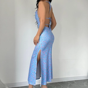 Detail of blue floral halter dress featuring a sexy backless design and high side slit