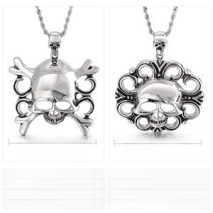 Close-up of vintage steel pirate skull pendants with detailed punk casting and crossbones
