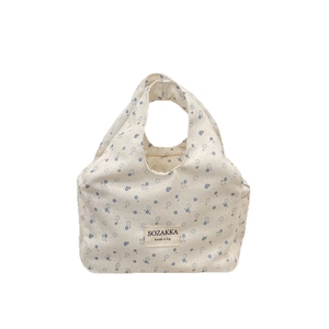 Floral canvas lunch bag with blue flower patterns and sturdy handles for daily use