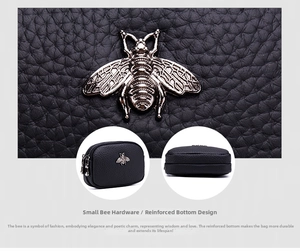 Detail of black lychee leather coin purse with double zipper and golden bee hardware