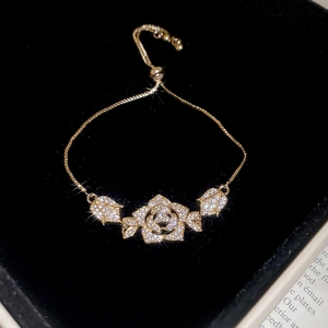 Macro detail of French style sparkling zircon flower bracelet with adjustable slider clasp