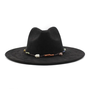 Detailed close-up of wide brim black fedora with bohemian stone beaded hat band detail