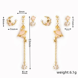 Detailed view of 18K gold plated moon and star earrings with pink stones and size labels