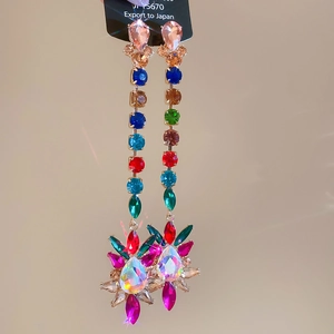Detail of long rainbow rhinestone tassel earrings with colorful drop pendants