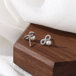 Infinity symbol 925 sterling silver stud earrings with pearls and zircon accents