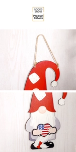 Close-up of wood gnome hanging decor with American flag heart and rustic twine rope