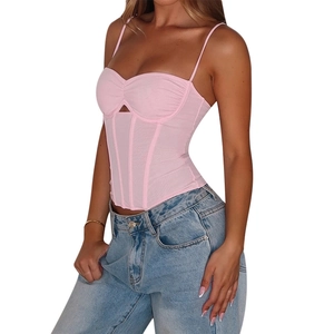 Detail shot of the pink ribbed corset top showing side fit and structured boning seams