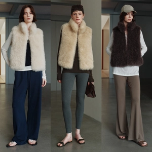 Short faux fox fur vest with stand collar in creamy white and dark brown colors