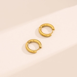 Detailed close-up of minimalist 18K gold plated stainless steel hoop earrings with clasp