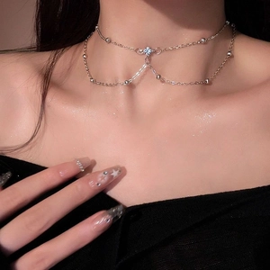 Double-layered silver body chain with star pendant and shimmering beads for women