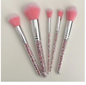 Detail of 5pcs makeup brushes with pink crystal filled handles and soft gradient bristles