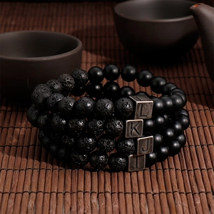 Set of 4 black lava stone bead bracelets with vintage stainless steel initial charms