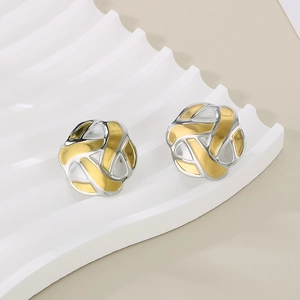 Detailed close-up of two-tone braided knot stud earrings in gold and silver finish