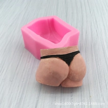 Macro detail of a pink silicone mold and finished soap shaped as female curves