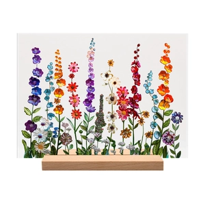 Macro view of floral acrylic desk plaque with vibrant 3D patterns and wooden base