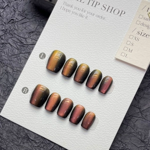 Cat eye magnetic press-on nails in dual-tone dragon fruit and black with short oval shape
