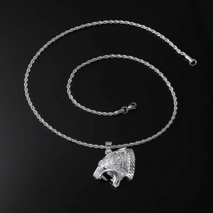 Detailed view of a silver leopard head pendant with sparkling rhinestones on a twist chain