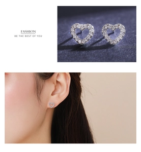 Macro detail and model view of 925 sterling silver heart earrings with sparkling zircons