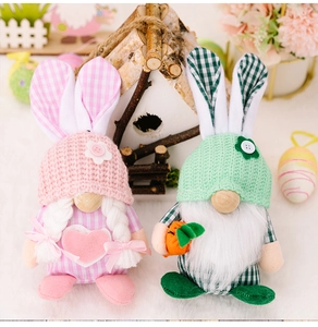 Close-up of Easter gnome plush set with rabbit ears and knitted textures on soft white fur