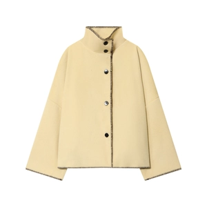 Women's light yellow cropped jacket with black contrast stitch and buttons