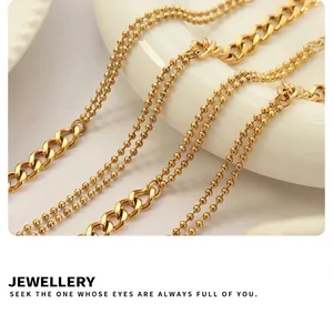 Detail of 18k gold plated titanium steel double-layered bead and Cuban chain jewelry