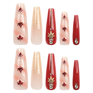 Dark red maple leaf press-on nails with gold glitter and rhinestones in coffin shape
