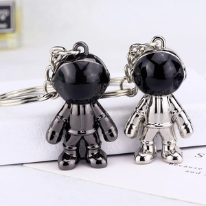 Astronaut keychains in gunmetal and silver finishes made of zinc alloy for bags