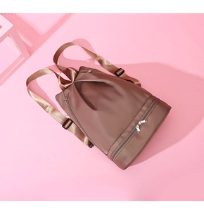 Detail view of the brown Oxford fabric backpack with separate wet dry shoe compartment