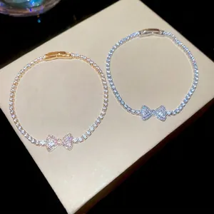 Sparkling zircon bowknot charm bracelet in gold and silver finish for women's jewelry