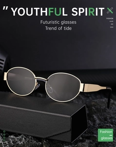 Detailed shot of retro oval gold frame sunglasses resting on a premium black case