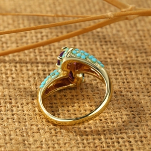 Vintage gold alloy ring with blue turquoise beads and an oval purple gemstone