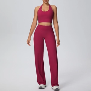 Detail of berry red halter yoga set featuring high-waist straight-leg pants and crop top