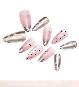 Detail of pink cat eye almond press-on nails with 3D silver mirror chrome and tiny rhinestones