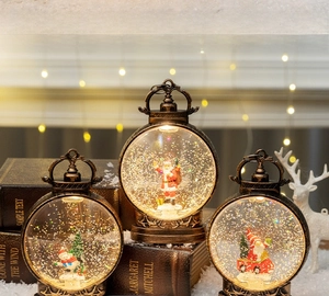 Close-up of vintage bronze LED lanterns with Santa and glitter snow scene for Xmas