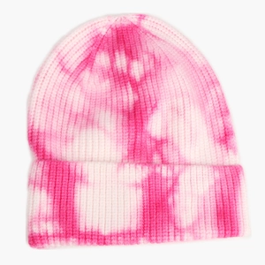 Detail of pink and white tie-dye knit beanie showing ribbed texture and folded cuff edge