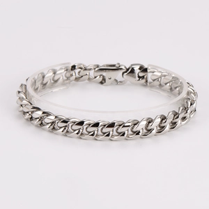 Detailed view of silver stainless steel Cuban link bracelet with lobster clasp closure