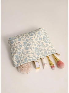 Floral print cosmetic bag in cream with blue patterns and high capacity storage