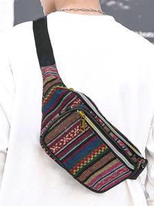 Detailed back view of a colorful bohemian woven waist bag with a golden zipper and strap