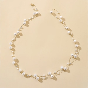 Elegant multi-layered pearl necklace with golden chain in a vintage U-shaped layout