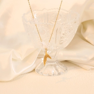 Elegant gold stainless steel necklace featuring natural pearls and a fish tail pendant